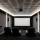 The image depicts a modern home theater featuring a sleek acoustic drop ceiling with integrated LED lighting, designed to enhance sound absorption and reduce noise transfer. The ceiling tiles are part of a drop ceiling system that adds a stylish touch while ensuring easy access to overhead utilities.
